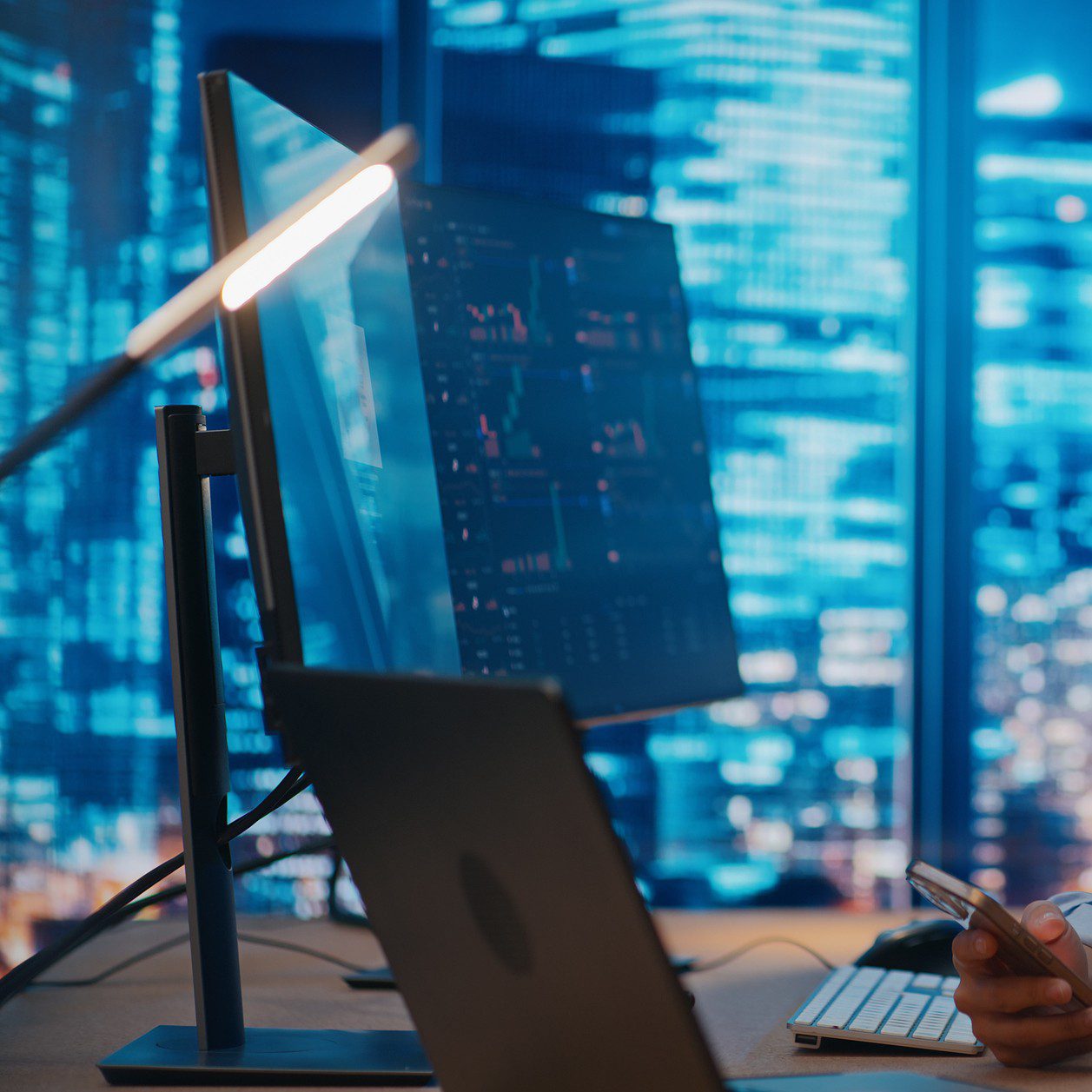 Person using computer in modern office setting.